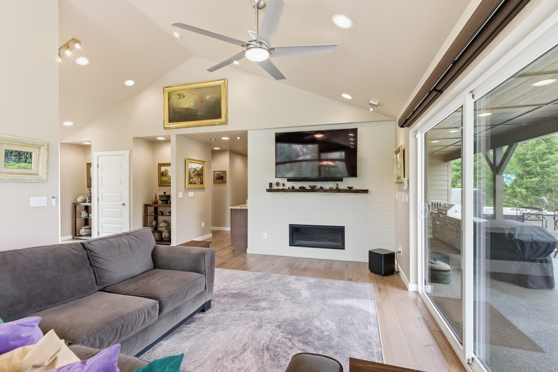 Great room with linear fireplace and wall of glass