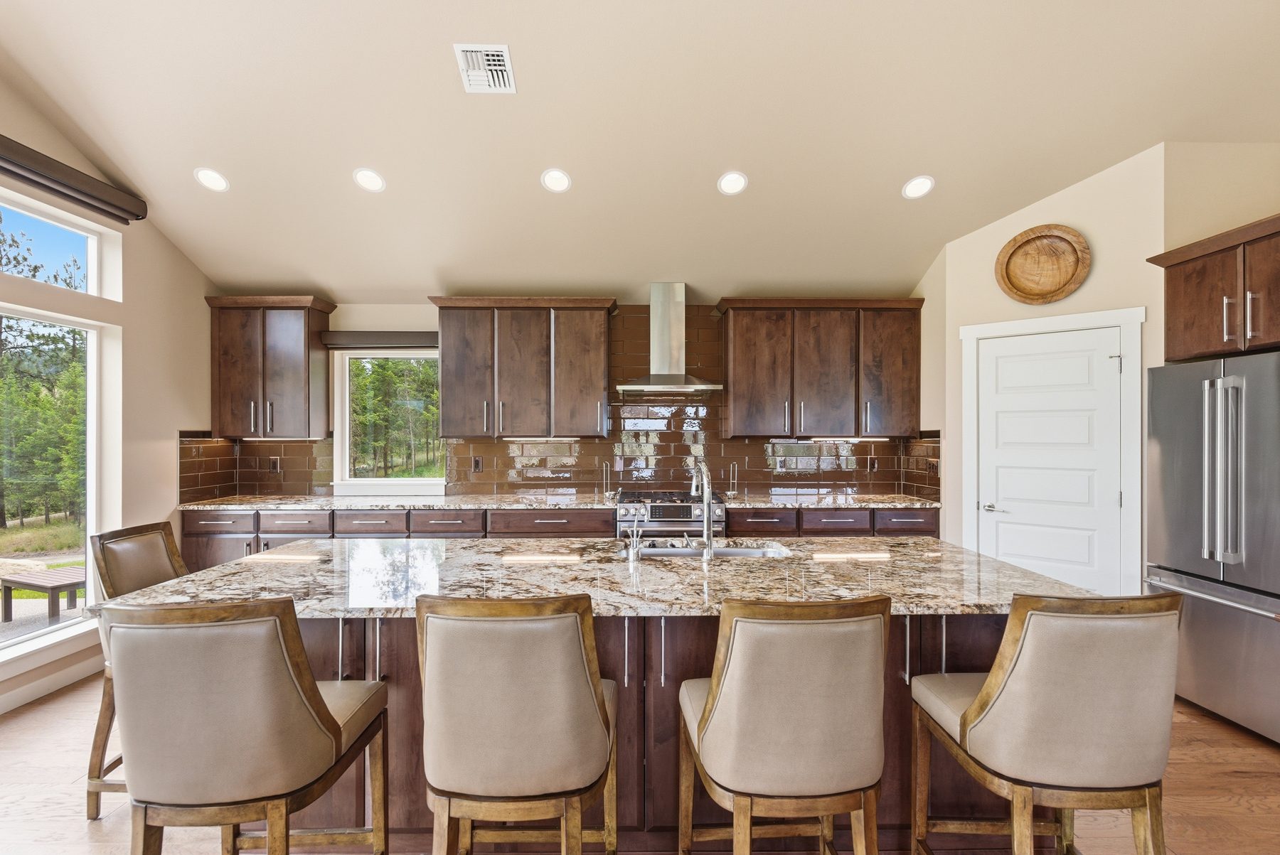 Large granite kitchen island with seating and valley view
