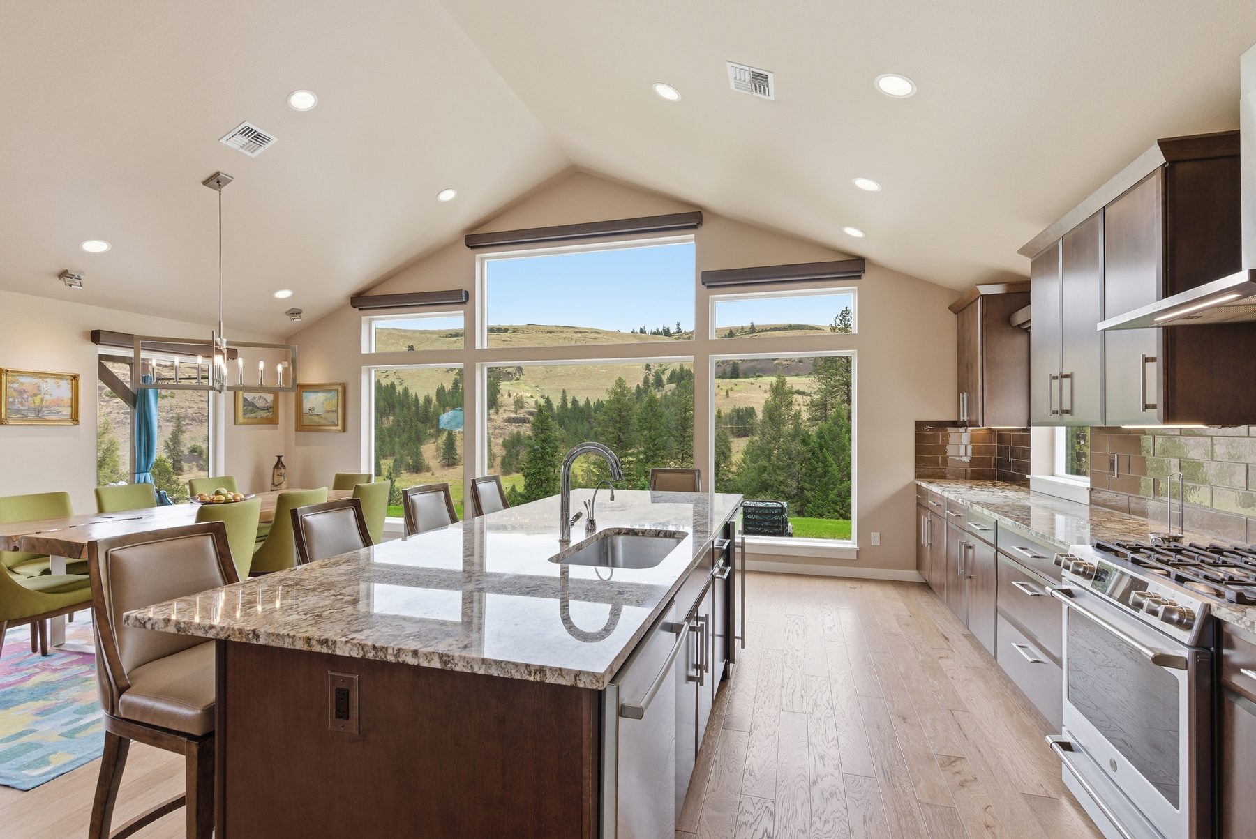 Vaulted kitchen with granite island and sweeping valley view