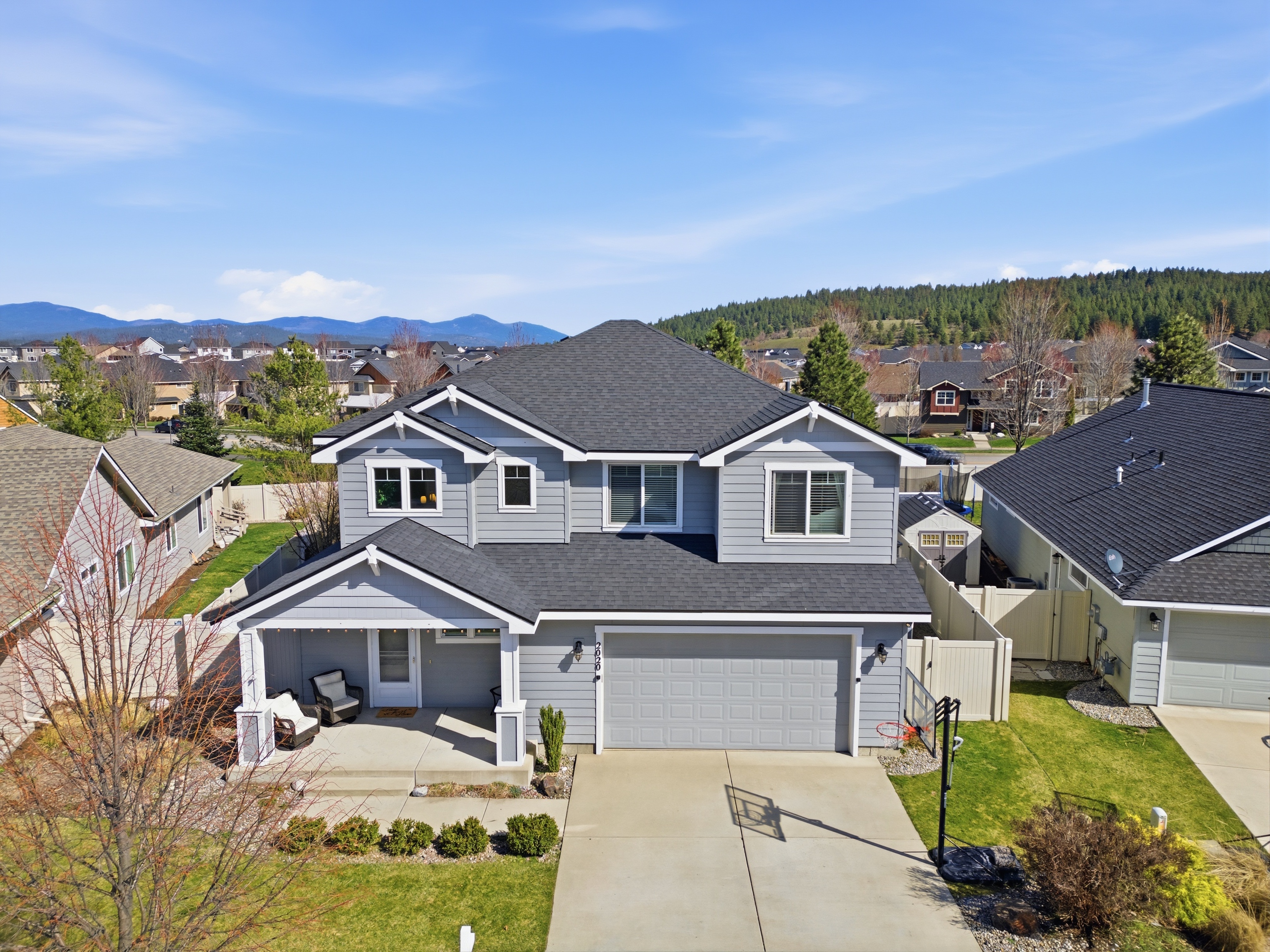 Aerial home with mountain backdrop