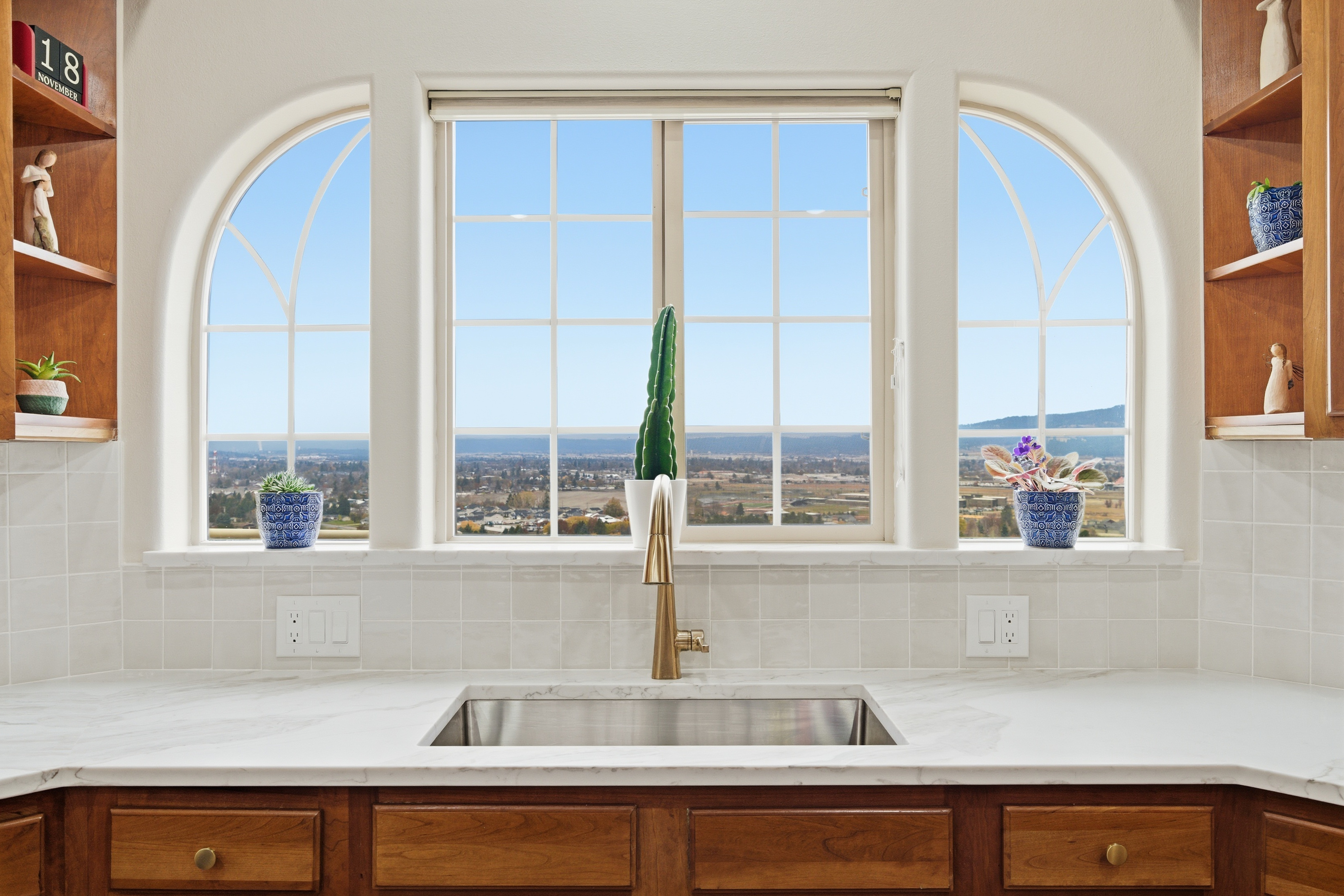 Kitchen with arched window and valley view