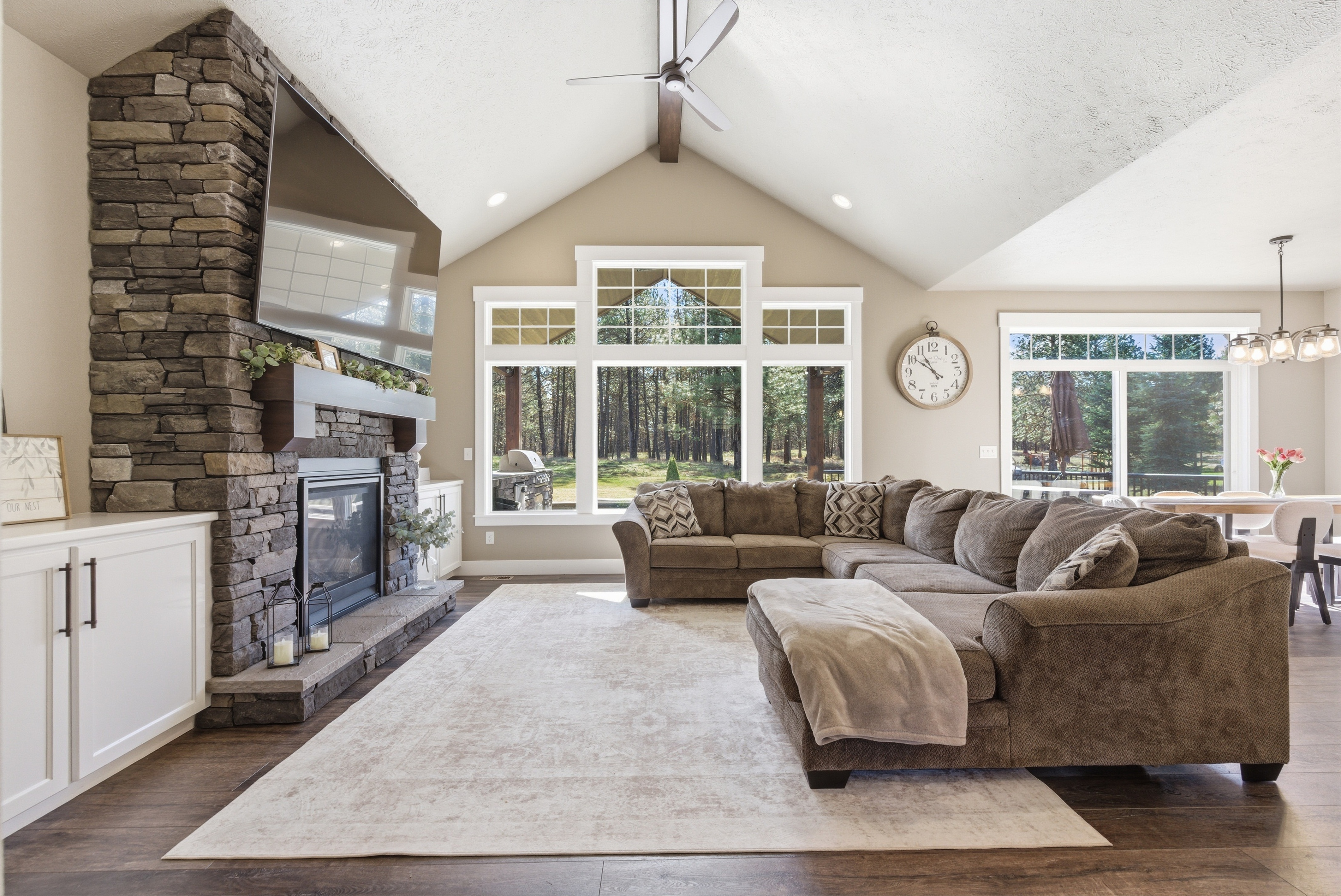 Luxury great room with stone fireplace
